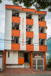 a building with orange and white at Hotel Iguazu in Villavicencio