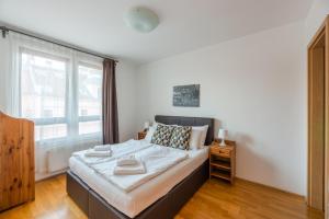 Posteľ alebo postele v izbe v ubytovaní Budapest Central Port Apartment