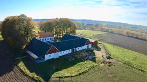 an aerial view of a large building on a field at Åkeslund in Hörby