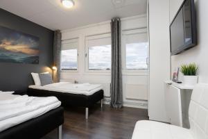 Postel nebo postele na pokoji v ubytování Hotel Vindeus