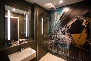 a bathroom with a sink and a mirror at Mercure Bridgwater in Bridgwater