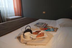 Postel nebo postele na pokoji v ubytování Hotel Metrò