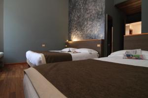 Postel nebo postele na pokoji v ubytování Hotel Metrò