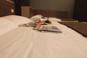 Postel nebo postele na pokoji v ubytování Hotel Metrò