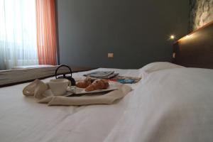 Postel nebo postele na pokoji v ubytování Hotel Metrò