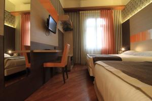 Postel nebo postele na pokoji v ubytování Hotel Metrò