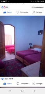 a picture of a bedroom with two beds in a room at Residence Tozeur Almadina in Tozeur