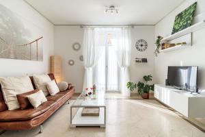 TV a/nebo společenská místnost v ubytování Gran Via Balconies