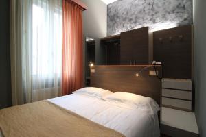 Postel nebo postele na pokoji v ubytování Hotel Metrò