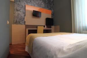 Postel nebo postele na pokoji v ubytování Hotel Metrò