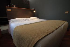 Postel nebo postele na pokoji v ubytování Hotel Metrò