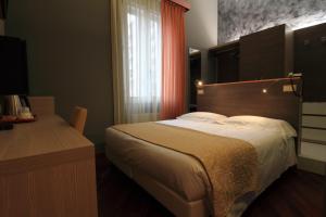 Postel nebo postele na pokoji v ubytování Hotel Metrò