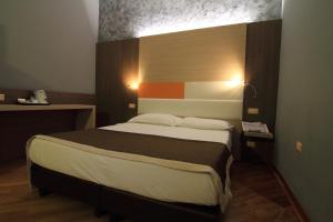 Postel nebo postele na pokoji v ubytování Hotel Metrò