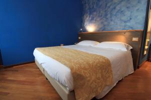 Postel nebo postele na pokoji v ubytování Hotel Metrò