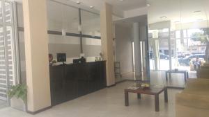 a lobby with a reception desk in a building at 770Hotel in Mar del Plata