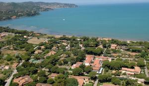 an aerial view of a residential neighborhood with a lake at Rta Airone in Orbetello