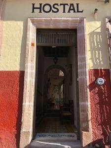 a building with a hospital sign on the side of it at Hostal Cielito De María in Zacatecas
