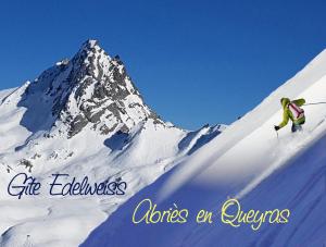 a person skiing down a snow covered mountain at Gite Edelweiss in Abriès