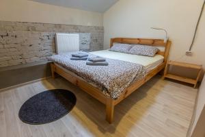 a bedroom with a bed with two towels on it at Vozduh MiniHotel in Vladimir