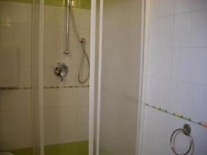 a shower with a glass door in a bathroom at Casa Nel Corso in Castellammare del Golfo