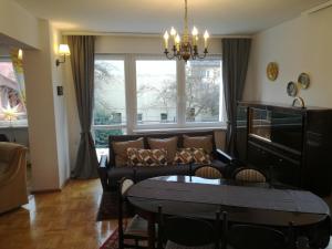 a living room with a couch and a table at Apartament Mamamiry in Głuchołazy