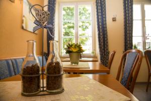 a table with two bottles on top of it at Hotel Perler Hof in Perl