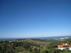 a view of the ocean from a hill at A Casinha in Sintra