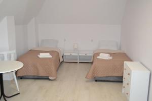 Łóżko lub łóżka w pokoju w obiekcie Zajazd Pod Skarpą