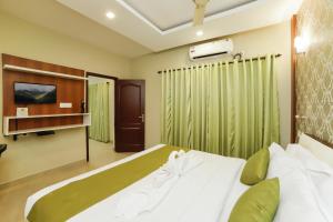 Cama o camas de una habitación en Sreepathi Indraprastha