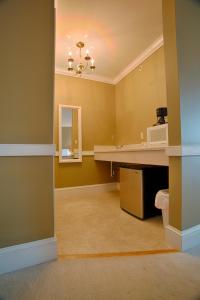 a bathroom with a sink and a mirror at Selinsgrove Inn in Selinsgrove