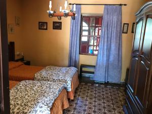 En eller flere senge i et værelse på Casa Casilda