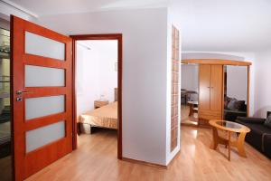Posteľ alebo postele v izbe v ubytovaní 100-SIO Apartamenty