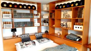 a room with wooden shelves with wine bottles at Martin´s House in Martin