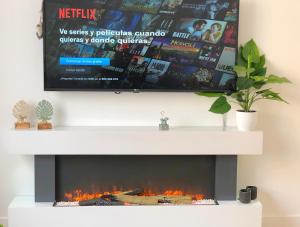 TV a/nebo společenská místnost v ubytování EXCLUSIVO Y LUMINOSO PISO EN EL PARQUE DEL RETIRO