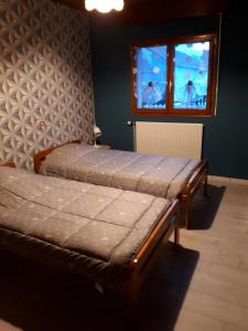 Ένα ή περισσότερα κρεβάτια σε δωμάτιο στο Au P'tit Gouy