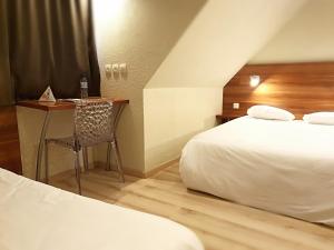 Cama o camas de una habitación en Hotel Primo Colmar Centre