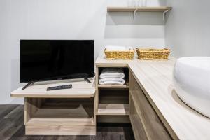 TV a/nebo společenská místnost v ubytování Place‧X Hotel