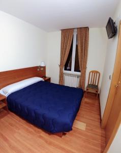 Postel nebo postele na pokoji v ubytování Hostal Prada Borges