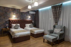 Letto o letti in una camera di Omart Hotel - Gallery