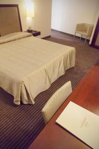 Postel nebo postele na pokoji v ubytování Hotel dei Gonzaga
