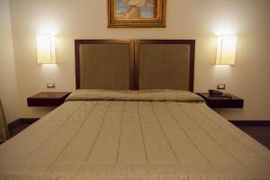 Postel nebo postele na pokoji v ubytování Hotel dei Gonzaga