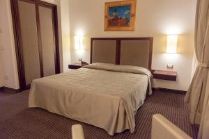 Postel nebo postele na pokoji v ubytování Hotel dei Gonzaga