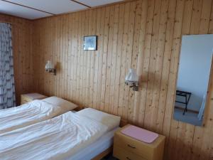 Postel nebo postele na pokoji v ubytování Hotel Bellevue