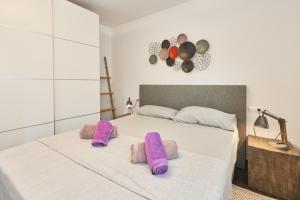 Łóżko lub łóżka w pokoju w obiekcie Casa Bianca