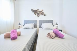 Łóżko lub łóżka w pokoju w obiekcie Casa Bianca