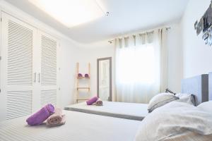 Łóżko lub łóżka w pokoju w obiekcie Casa Bianca