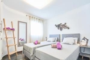 Łóżko lub łóżka w pokoju w obiekcie Casa Bianca