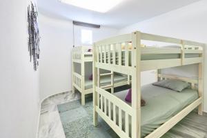 Łóżko lub łóżka w pokoju w obiekcie Casa Bianca
