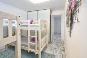 Łóżko lub łóżka w pokoju w obiekcie Casa Bianca
