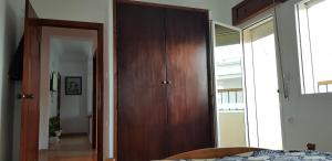 Кровать или кровати в номере Jolie appartement vue mer